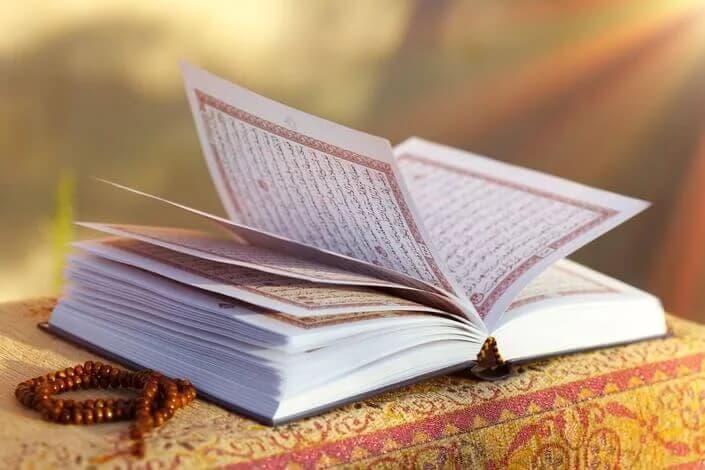 Open Quran with beautiful calligraphy